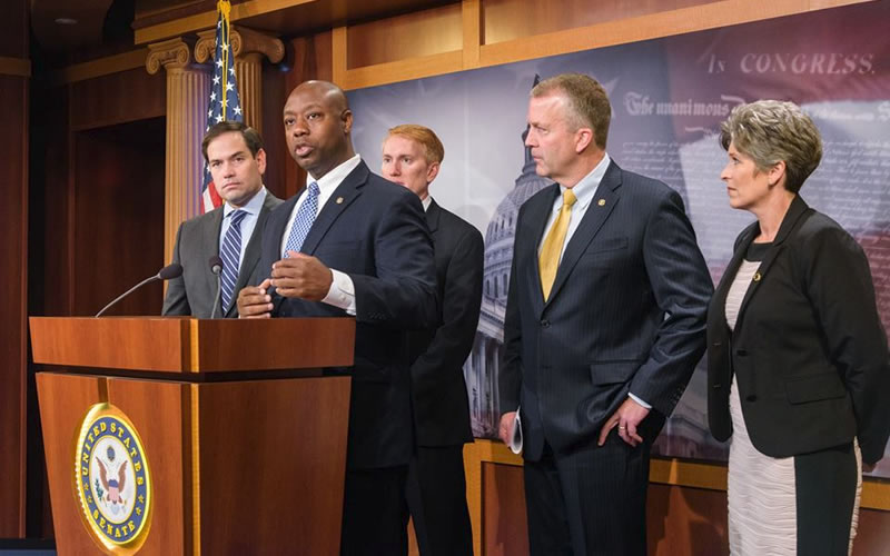 U.S. Sen. Tim Scott, at podium, discusses formation of the Senate Opportunity Caucus at a Capitol Hill press conference in September.