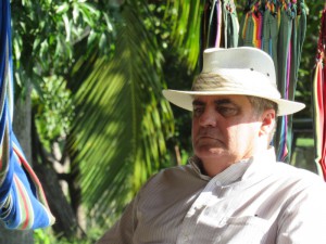 Johnson listens during a discussion at a Cuban farm.
