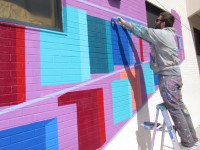PHOTO:  World-renowned artist paints bright library mural