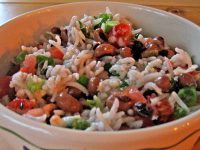 Traditionalists may wonder why tomatoes and scallions are pictured in this version of hoppin' john.  We can't give you the answer but will attest to the opinion that the added combination makes the dish extra good -- the editors.