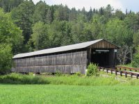A covered bridge along the New Hampshire and Vermont border at Lunenburg, Vermon.  It is 266 feet long.  Built in 1911.