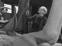 Huntington working on a sculpture of a horse.