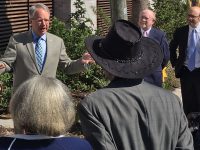 Mayor John Tecklenburg, left, speaks at an event earlier this month at Williams Terrace.  At right are Charleston Housing Authority Executive Director Don Cameron and the agency's board chair, Edward Kronsberg.