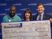 Rickey Watson, left, received a scholarship check from Board Chair Lee Deas and CEO Bob Smith. Watson now will now be able to attend a welding certification course offered as part of Palmetto Goodwill’s Career Credentialing Program. (Photo provided.)