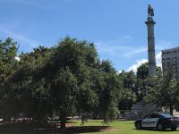 Police monitor the Calhoun monument at Marion Square.