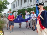 Officials walk with a Mountrie flag to raise it on Sullivan's Island, celebrating the 244th anniversary of Carolina Day.  Photos by Rob Byko.